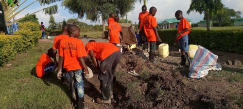 The aspiring engineers work on a project in the community.